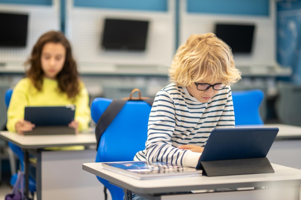 Students with various digital devices